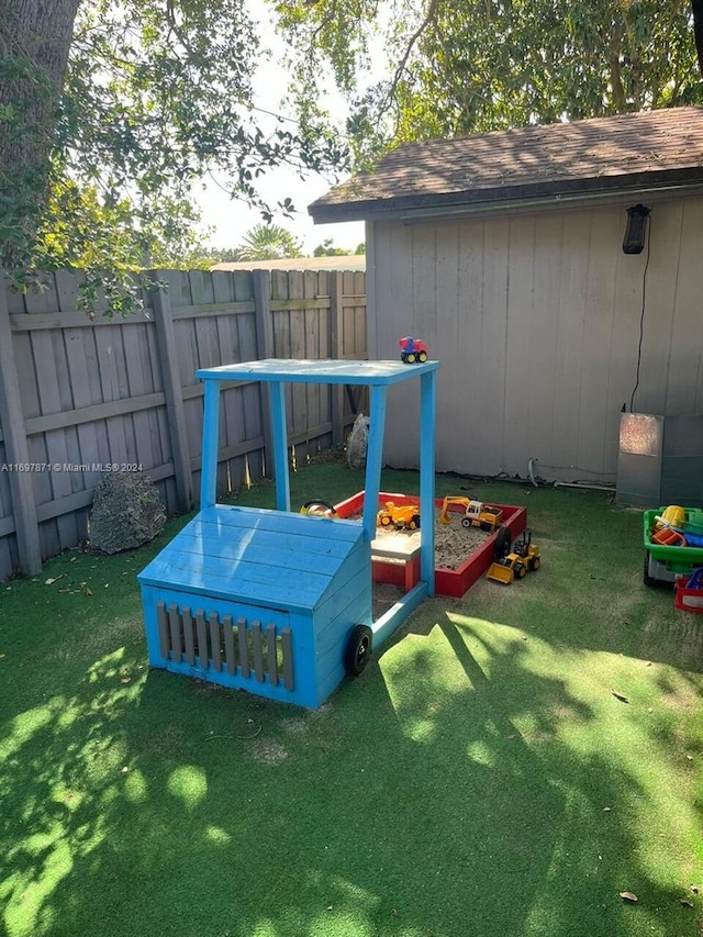 view of play area with a yard