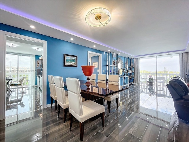 dining space featuring a wealth of natural light and hardwood / wood-style flooring