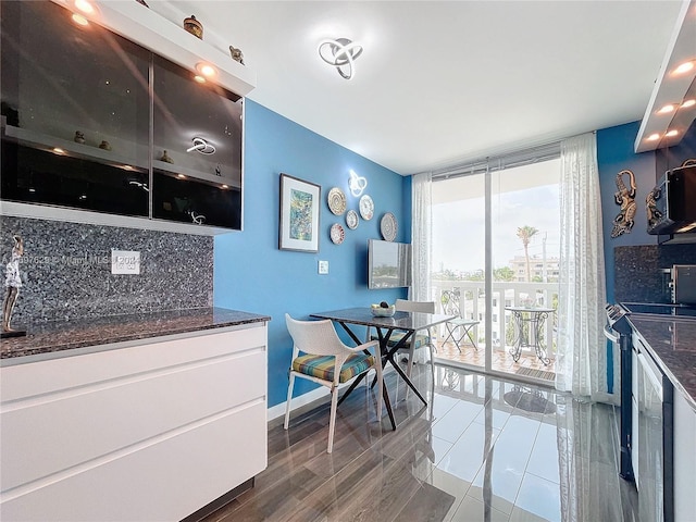 dining space with dark wood-type flooring