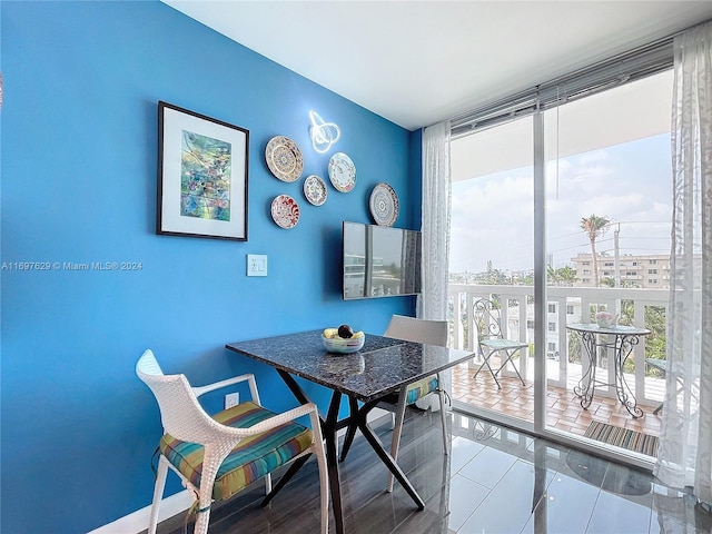 tiled dining area featuring a wealth of natural light