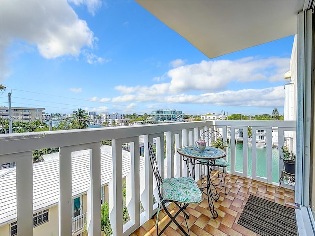 balcony featuring a water view