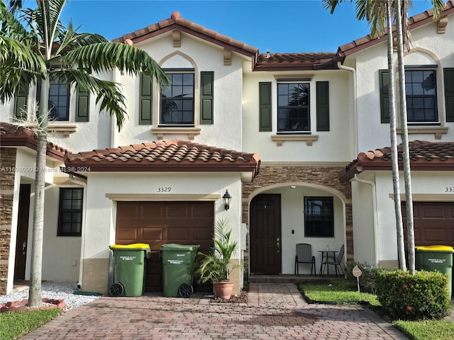 mediterranean / spanish-style house featuring a garage