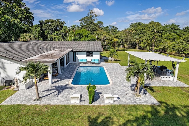 view of pool with a lawn, outdoor lounge area, and a patio