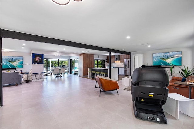 living room with beamed ceiling