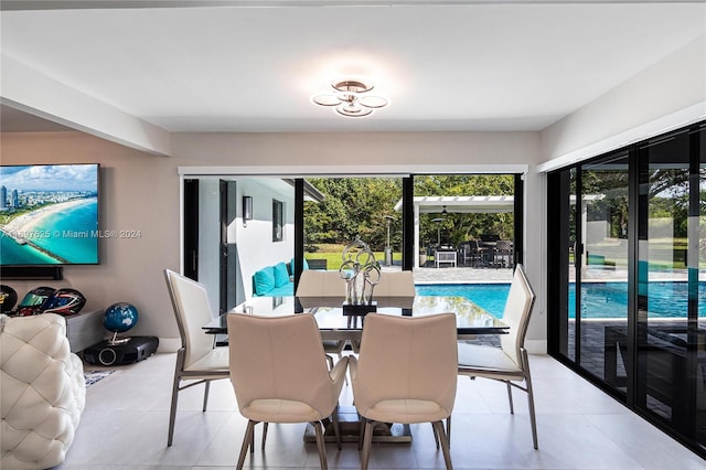 dining room featuring a wealth of natural light and light tile patterned flooring