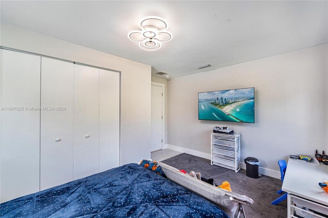 carpeted bedroom with a closet