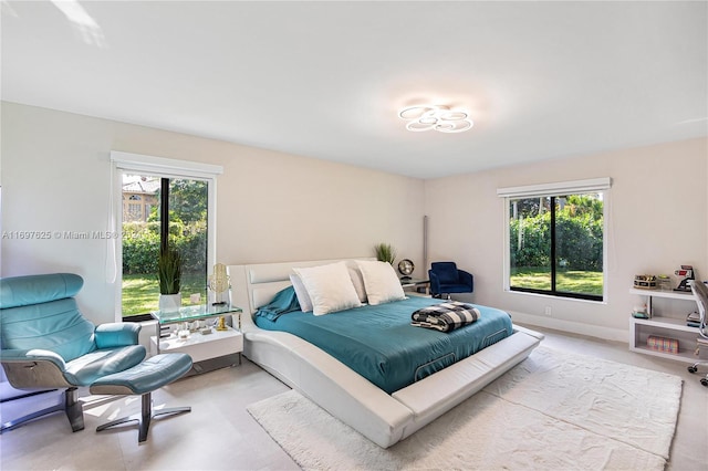 bedroom featuring multiple windows