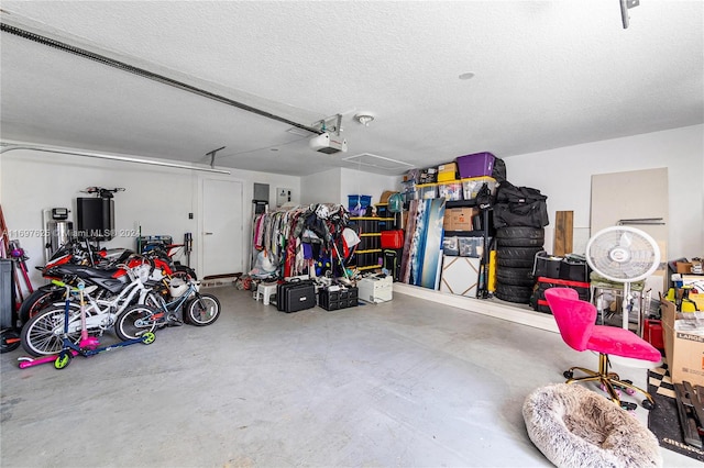 garage with a garage door opener and water heater