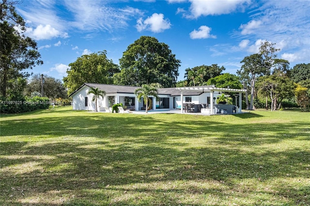 back of house featuring a yard, a pergola, and a patio area