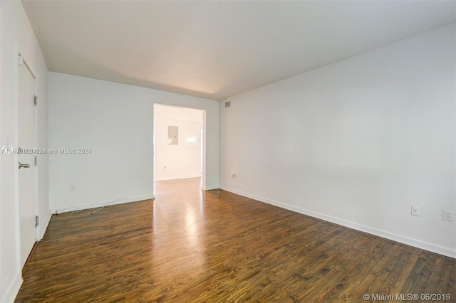 empty room with dark wood-type flooring