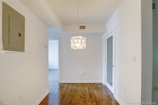 interior space with electric panel and dark wood-type flooring