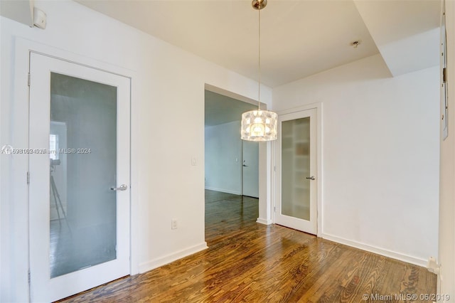 unfurnished room featuring dark wood-type flooring