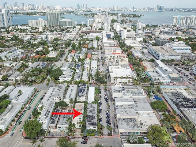 birds eye view of property featuring a water view