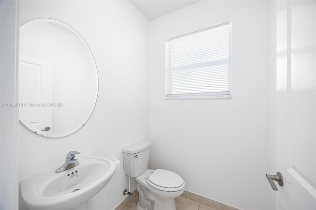 bathroom with tile patterned floors, sink, and toilet