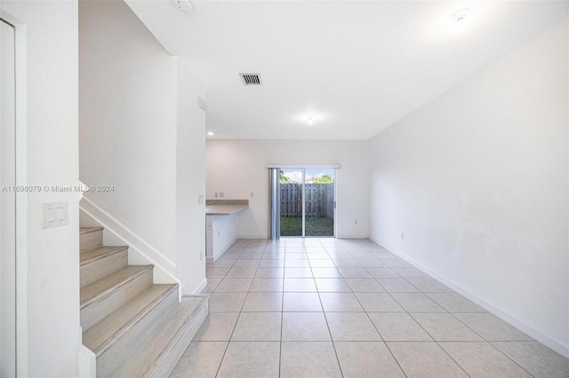 empty room with light tile patterned floors