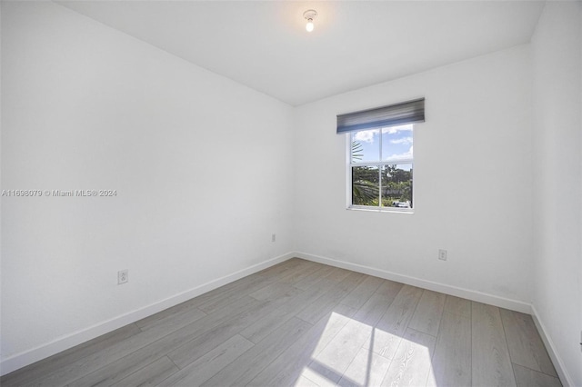 unfurnished room with light hardwood / wood-style floors