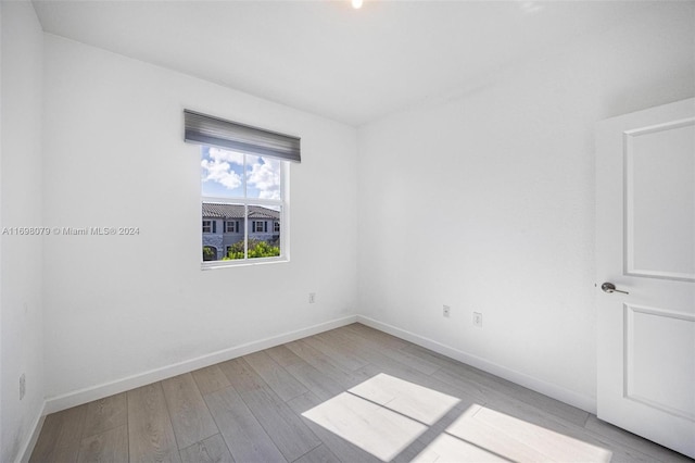 spare room with light wood-type flooring