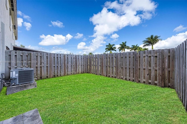 view of yard with central air condition unit