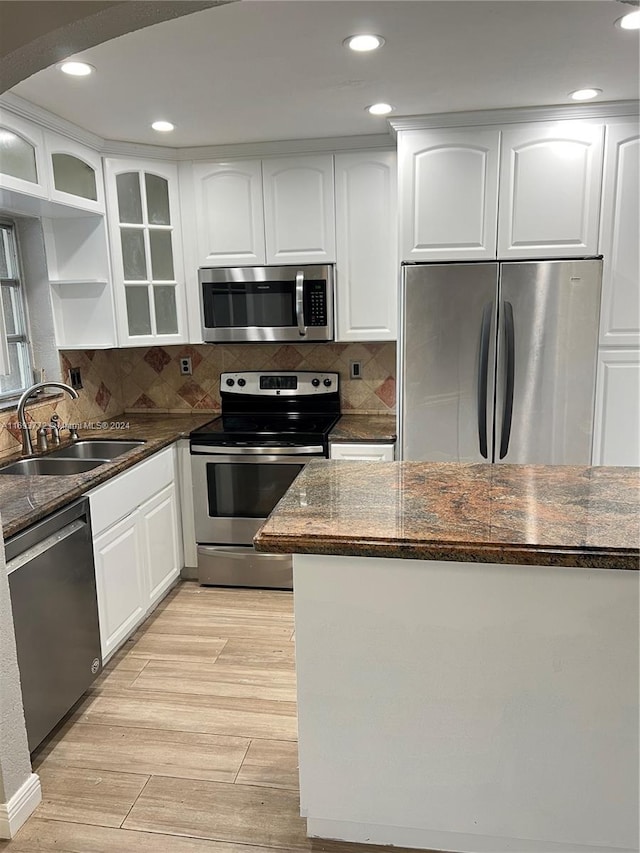 kitchen featuring white cabinetry, sink, and appliances with stainless steel finishes