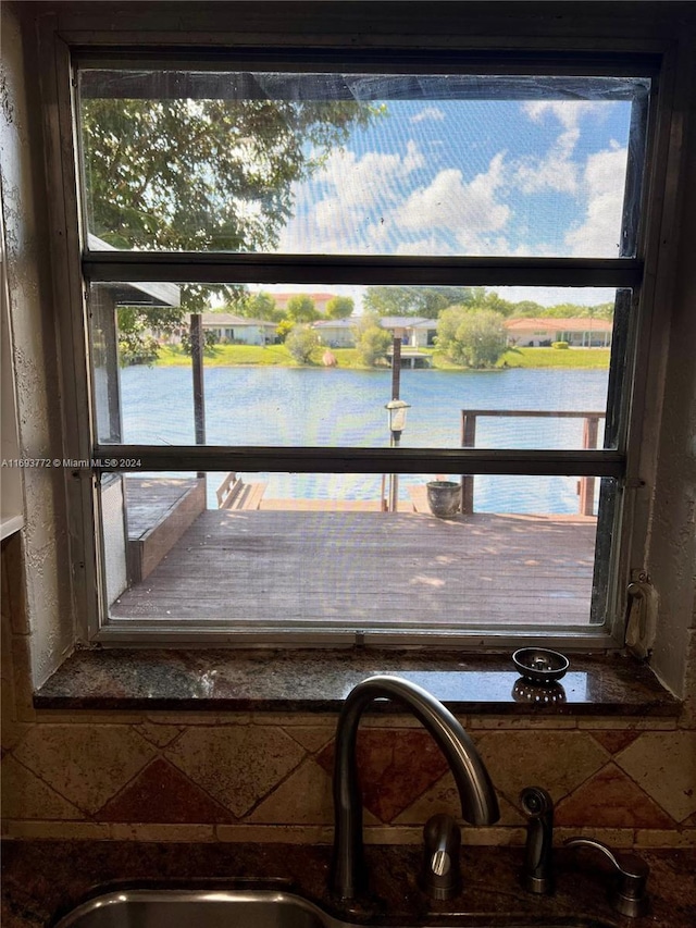 interior space featuring sink and a water view