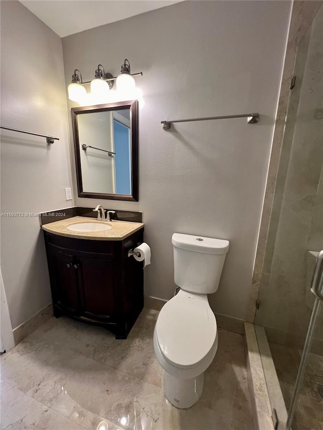 bathroom with vanity, toilet, and walk in shower