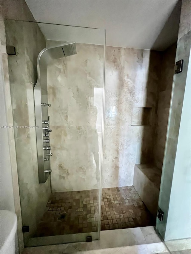 bathroom featuring an enclosed shower