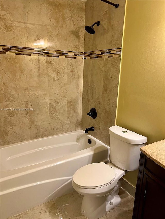 full bathroom featuring toilet, tile patterned floors, vanity, and tiled shower / bath combo