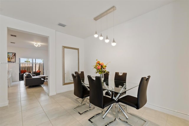 dining area with tile patterned floors