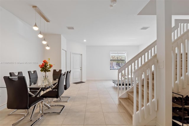 dining space with light tile patterned flooring