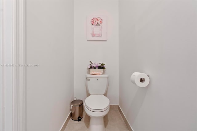 bathroom with tile patterned floors and toilet