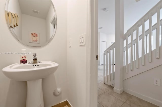 bathroom with tile patterned floors