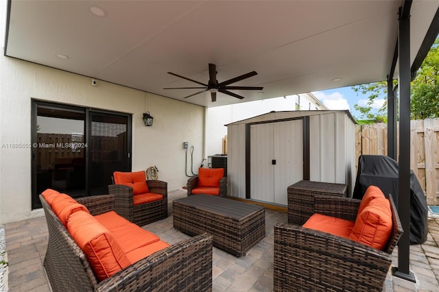 view of patio featuring a storage unit, ceiling fan, and an outdoor hangout area