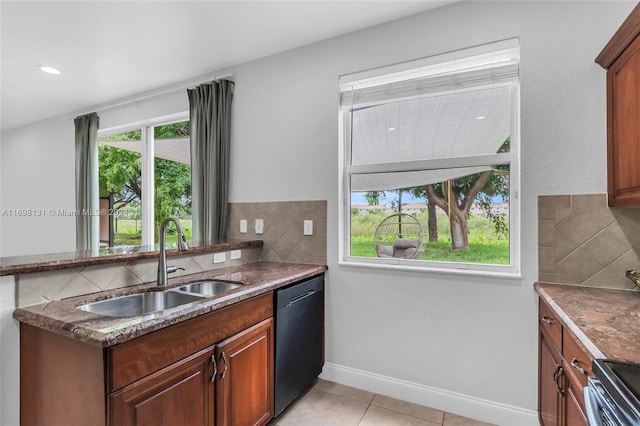 kitchen featuring dishwasher, a healthy amount of sunlight, light tile patterned floors, and sink