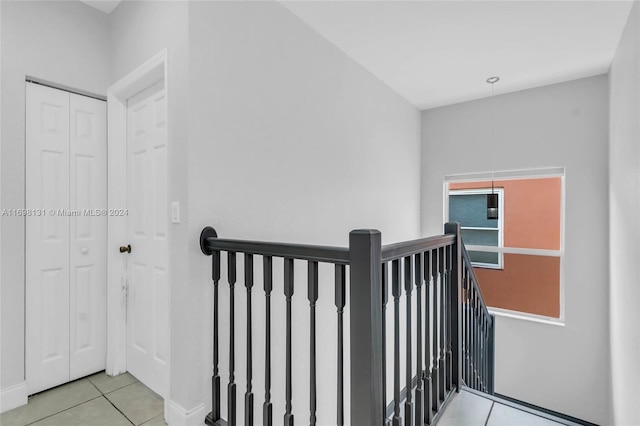 stairway featuring tile patterned floors