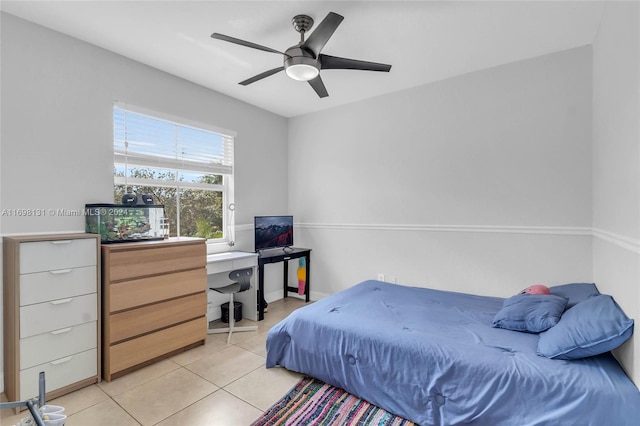 bedroom with ceiling fan and light tile patterned floors