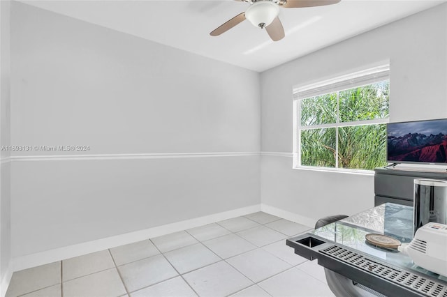 tiled office space with ceiling fan