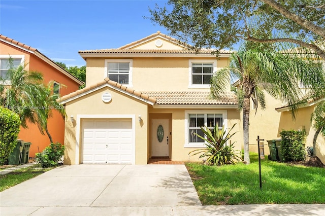 mediterranean / spanish house featuring a garage and a front lawn