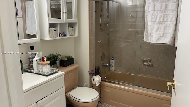 full bathroom with vanity, toilet, and bath / shower combo with glass door