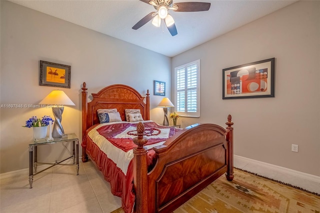 tiled bedroom with ceiling fan