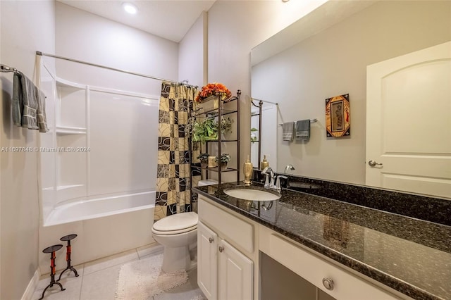 full bathroom featuring toilet, vanity, tile patterned floors, and shower / bath combo with shower curtain