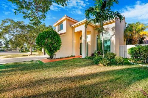 mediterranean / spanish-style home featuring a front lawn