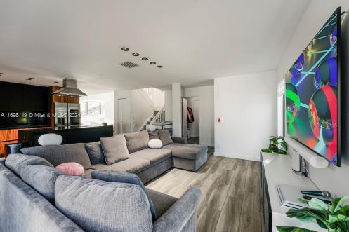 living room with wood-type flooring