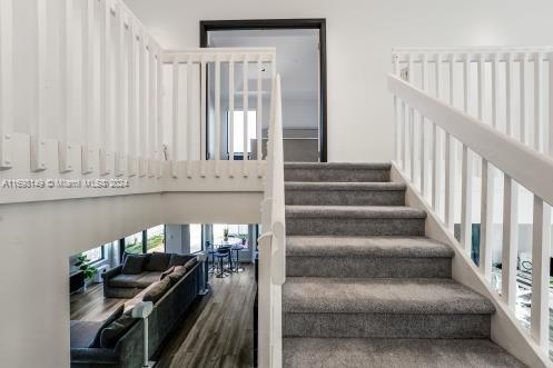 stairway featuring hardwood / wood-style floors