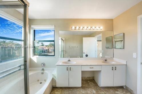 bathroom with separate shower and tub and vanity