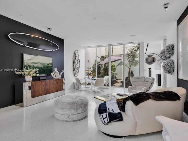 living room featuring floor to ceiling windows