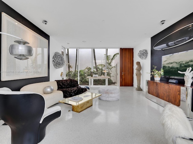 living room featuring floor to ceiling windows