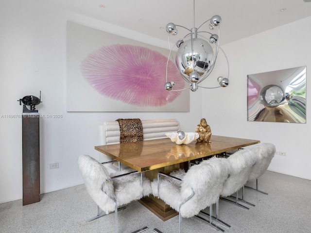 dining space featuring a notable chandelier