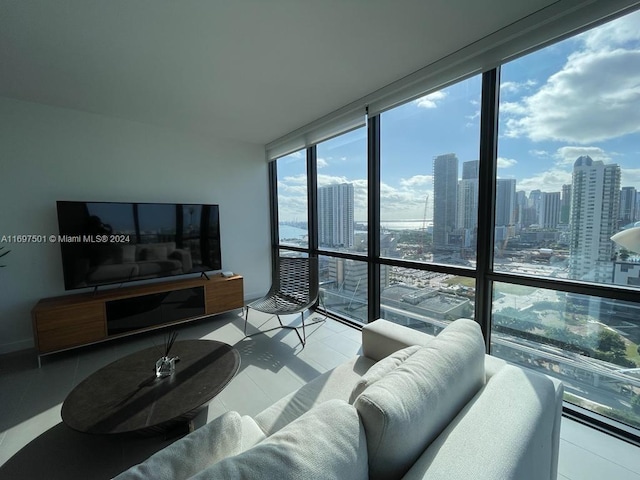 tiled living room with floor to ceiling windows