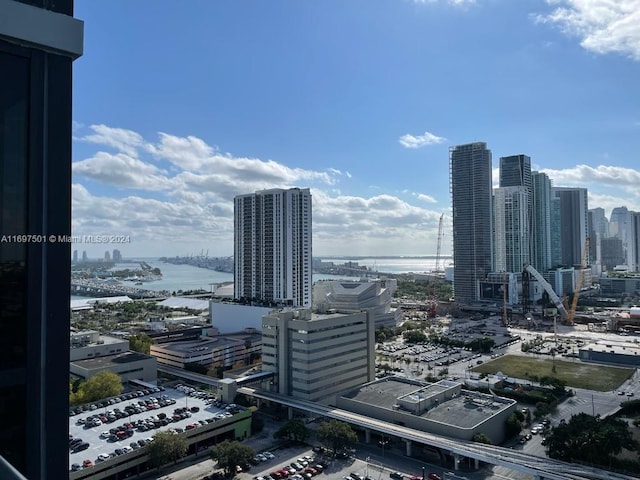 property's view of city featuring a water view