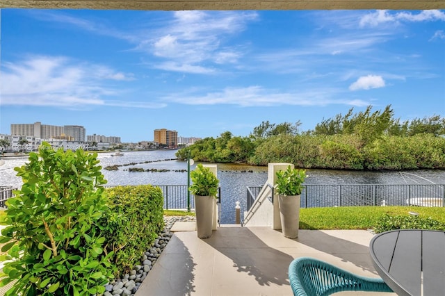 view of patio with a water view